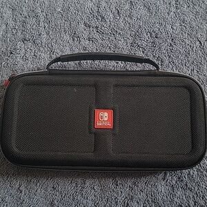 Nintendo Switch Game Traveler Deluxe Case, black, gently used.